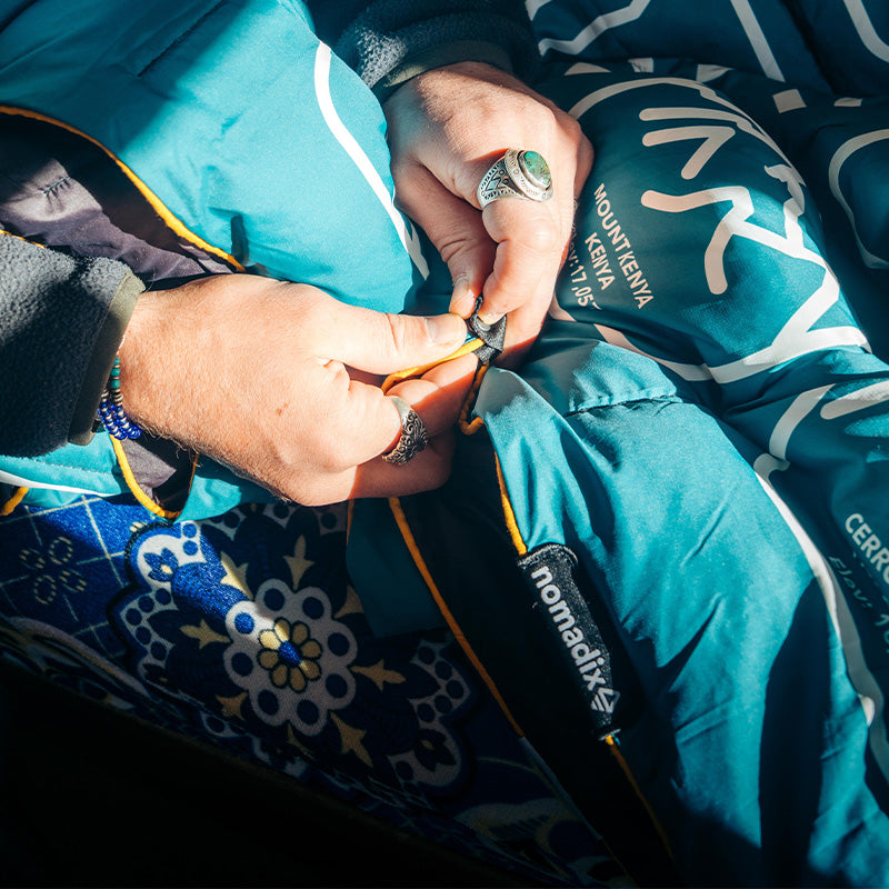 Nomadix Graphene Puffer Blanket: Peaks of the World Teal Ocean